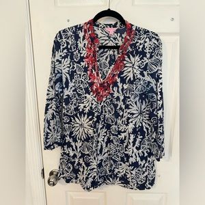 Navy and white printed Lilly Pulitzer Sarasota tunic with red beads.